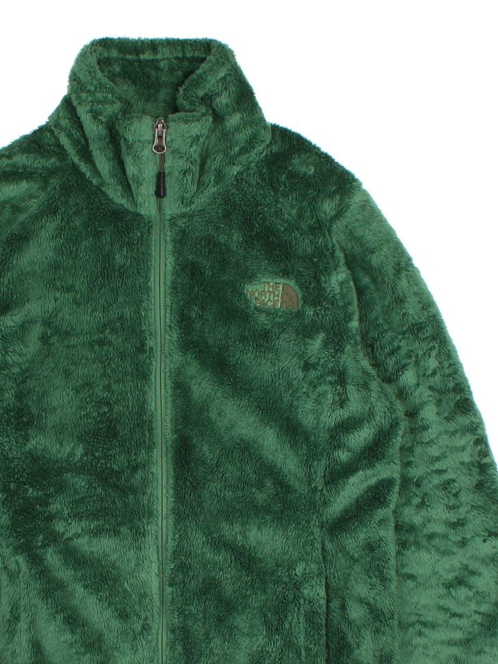 The North Face Osito Fleece in a dark green colourway. Full zip with pockets, drawstring hem and small classic logo on the front.