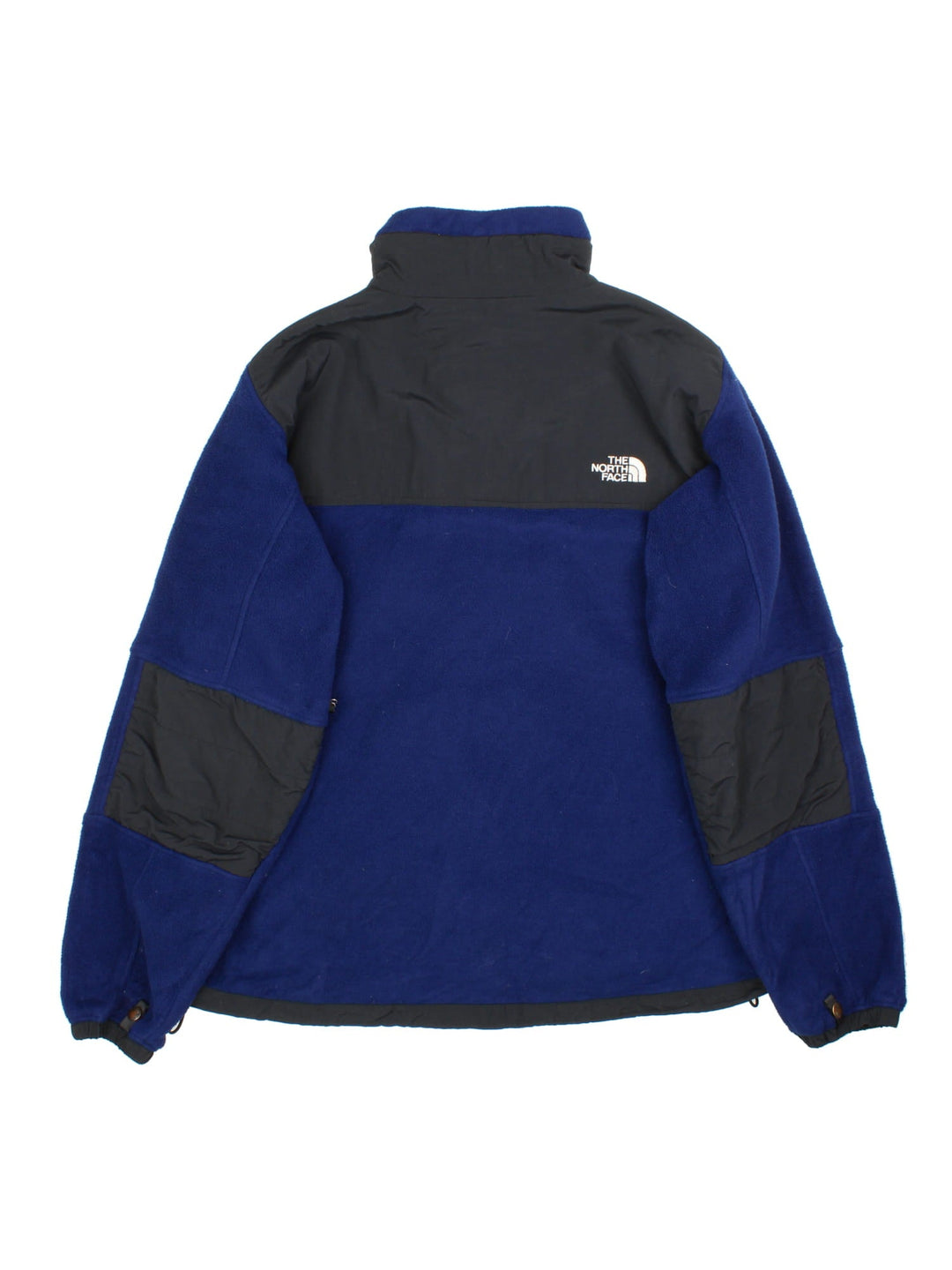 The North Face Denali Fleece in a blue & black colourway. Full zip with multiple pockets on the sides and under arms. Drawstring hem, elbow patches and classic small logo on the front and back.