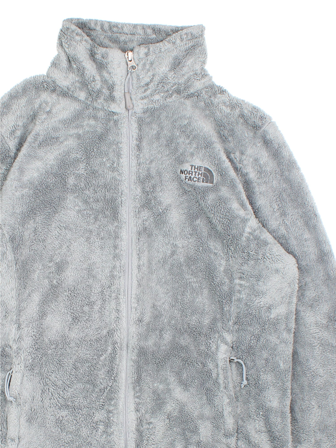 The North Face Osito Fleece in a grey colourway. Full zip with two pockets and small classic logo on the front.