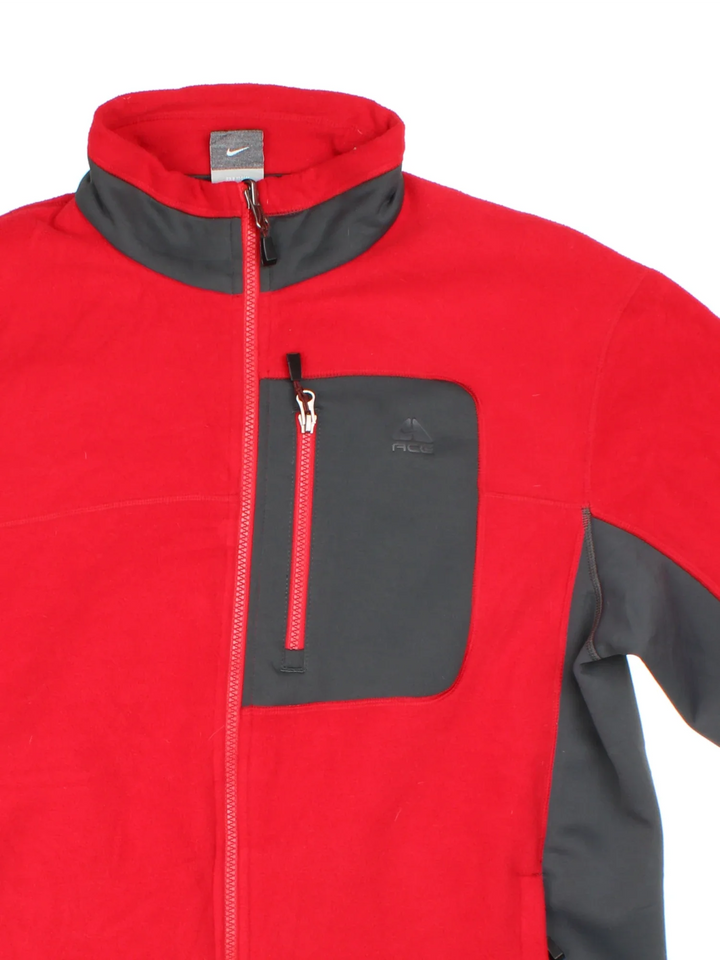Vintage Nike ACG Fleece in a red and grey colourway. Zips up and has multiple pockets, and the logo on the front.