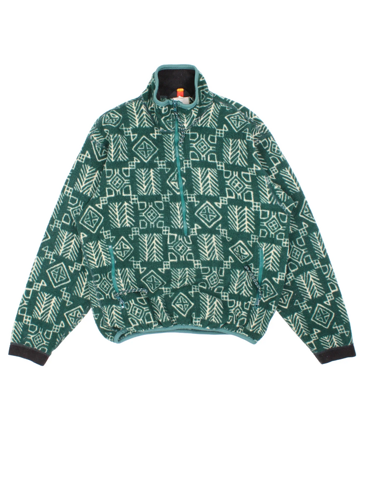 Vintage 90's REI Patterned Fleece in a green colourway with all over abstract pattern. Half zip closure and has a pouch pocket, and the logo embroidered on the back of the collar.