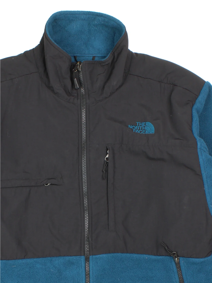 Vintage The North Face Denali Fleece in a blue and black colourway. Zips up and has multiple pockets, and the logo embroidered on the front and back.