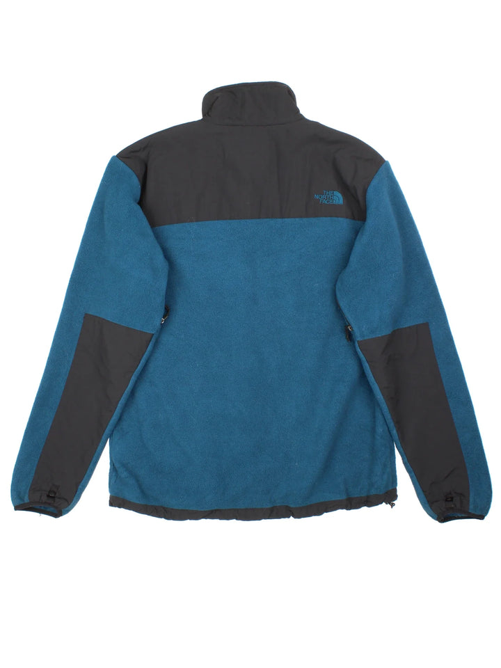Vintage The North Face Denali Fleece in a blue and black colourway. Zips up and has multiple pockets, and the logo embroidered on the front and back.