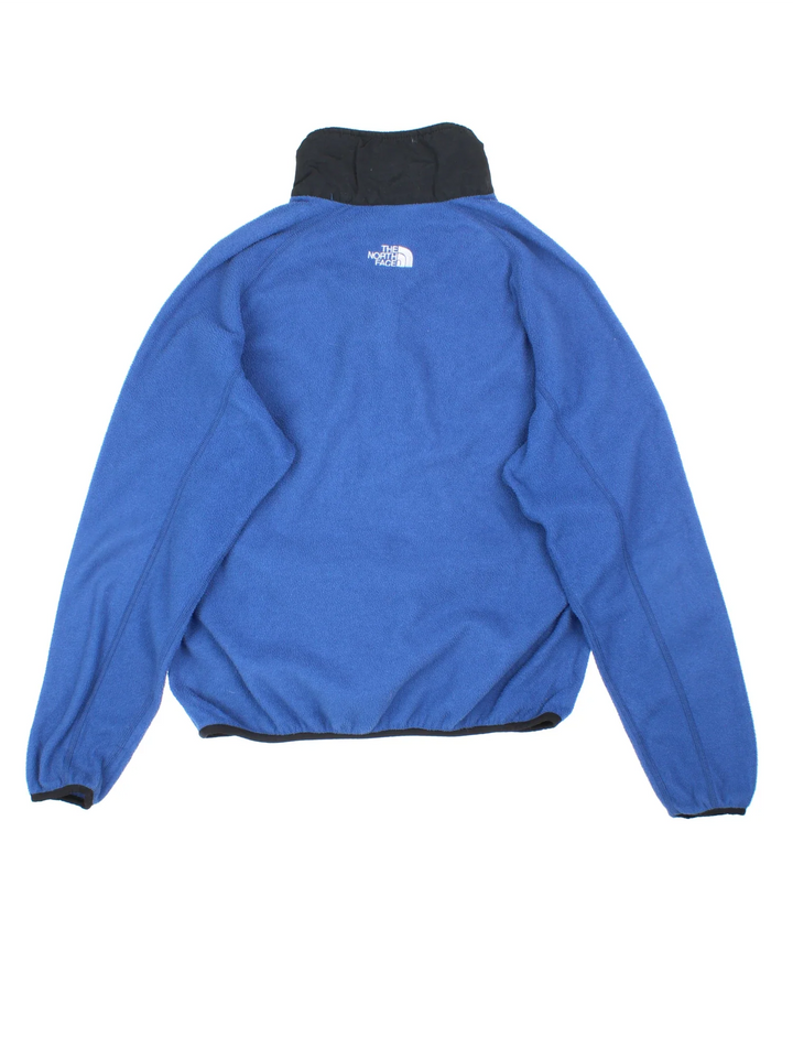 Vintage The North Face Pullover Fleece in a blue colourway. Half zip closure and has side pockets, and the logo embroidered on the front and back.