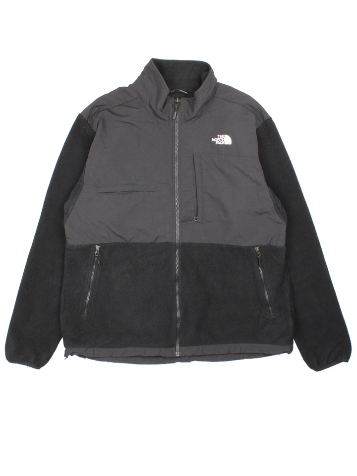 Vintage The North Face Denali Fleece in a black colourway. Zips up and has multiple pockets, and the logo embroidered on the front and back.