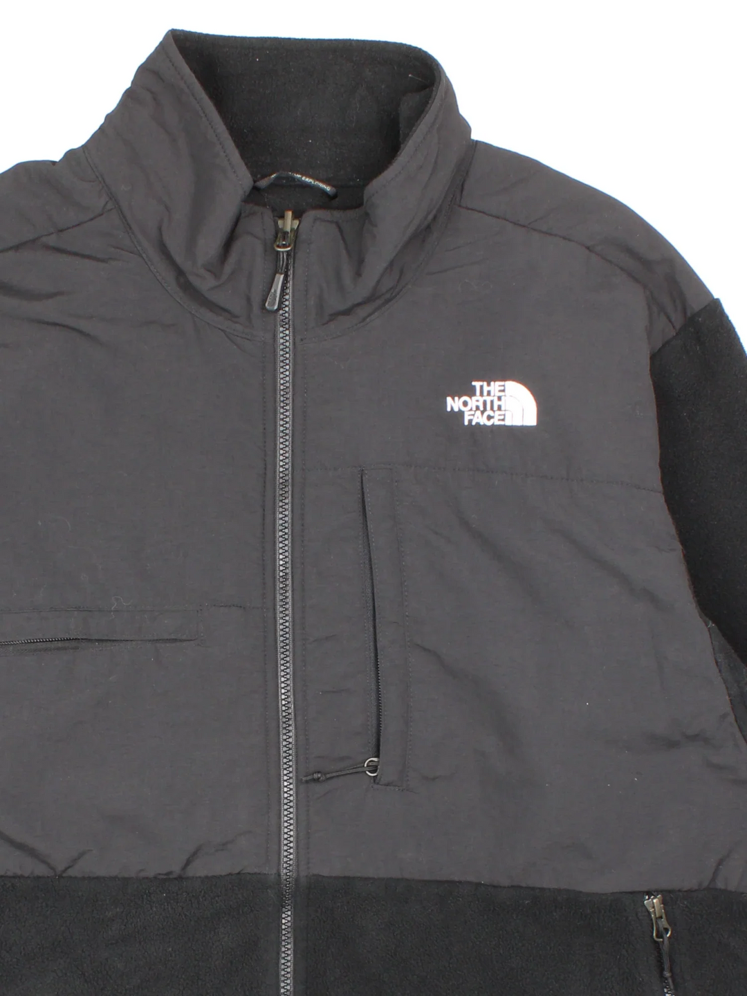 Vintage The North Face Denali Fleece in a black colourway. Zips up and has multiple pockets, and the logo embroidered on the front and back.