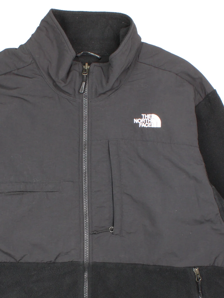 Vintage The North Face Denali Fleece in a black colourway. Zips up and has multiple pockets, and the logo embroidered on the front and back.