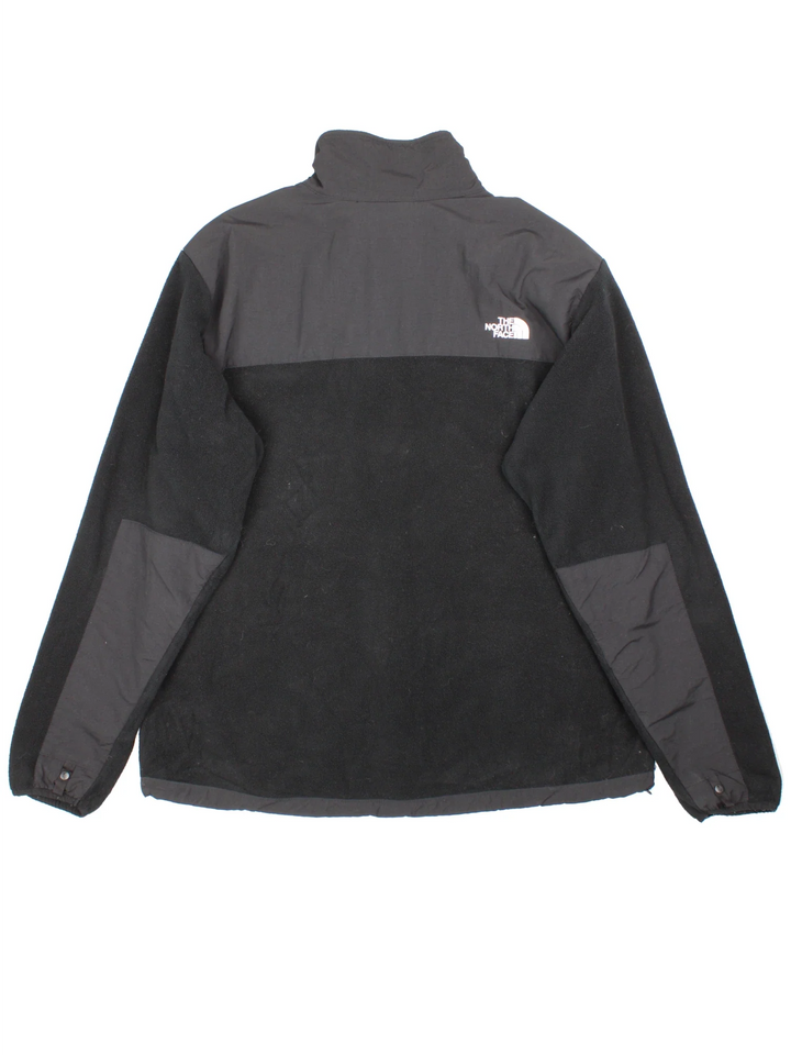 Vintage The North Face Denali Fleece in a black colourway. Zips up and has multiple pockets, and the logo embroidered on the front and back.