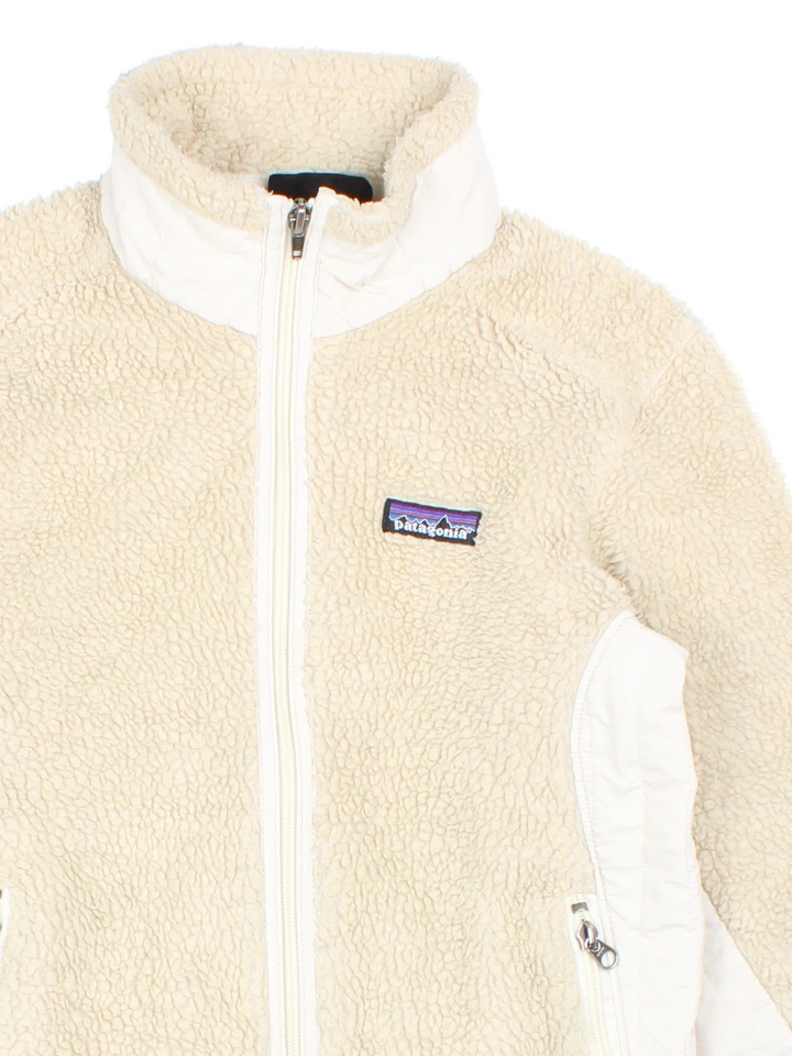 Vintage Patagonia Retro-X Fleece in a tan colourway. Zips up and has side pockets, and the logo embroidered on the front.