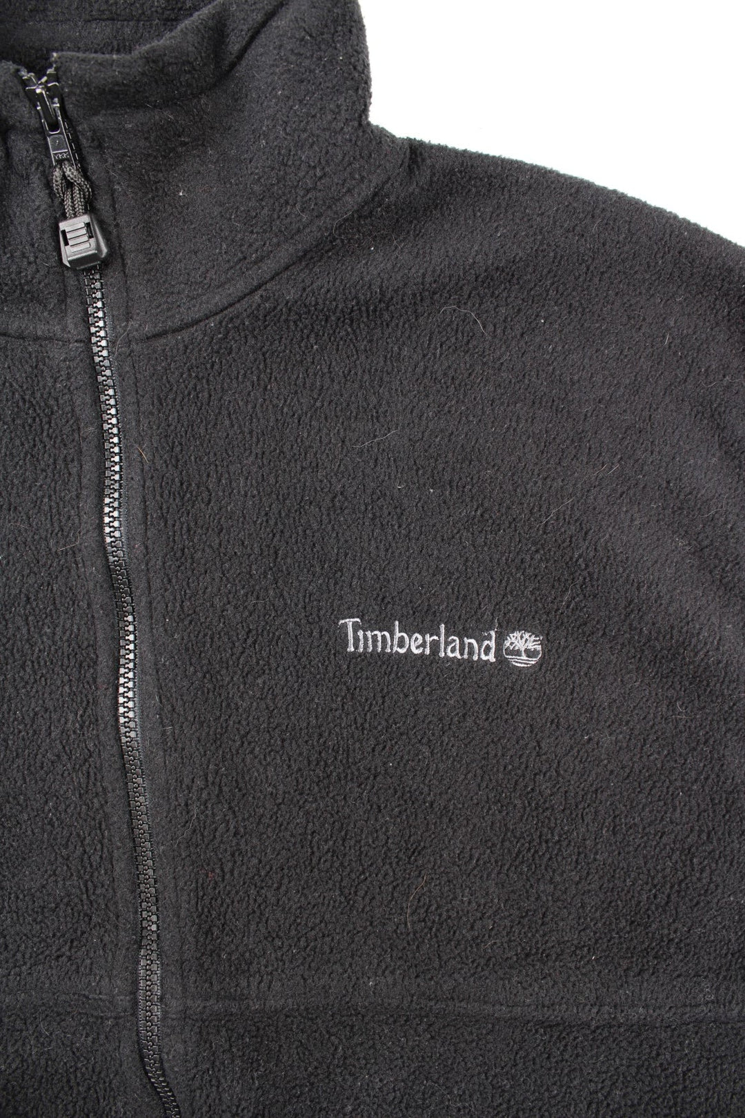 Vintage Timberland Fleece Vest in a black colourway. Zip up and has side pockets, logo embroidered on the front.
