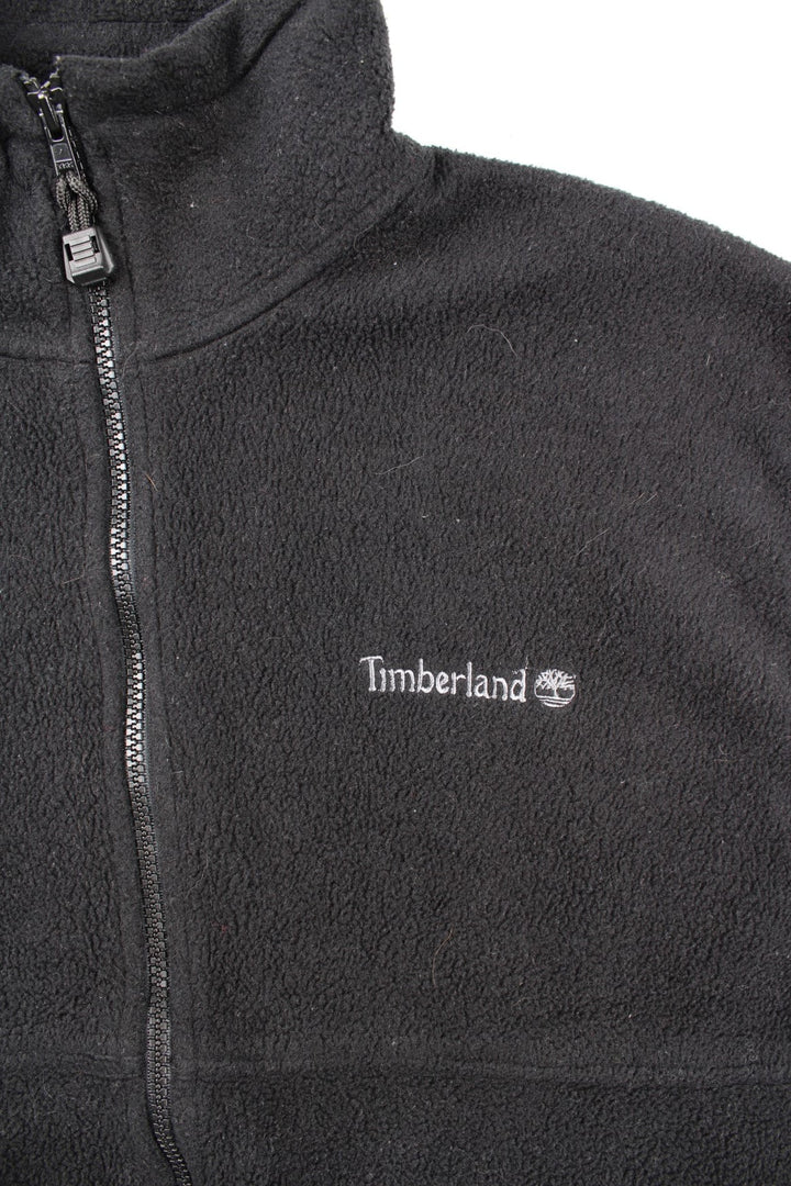 Vintage Timberland Fleece Vest in a black colourway. Zip up and has side pockets, logo embroidered on the front.