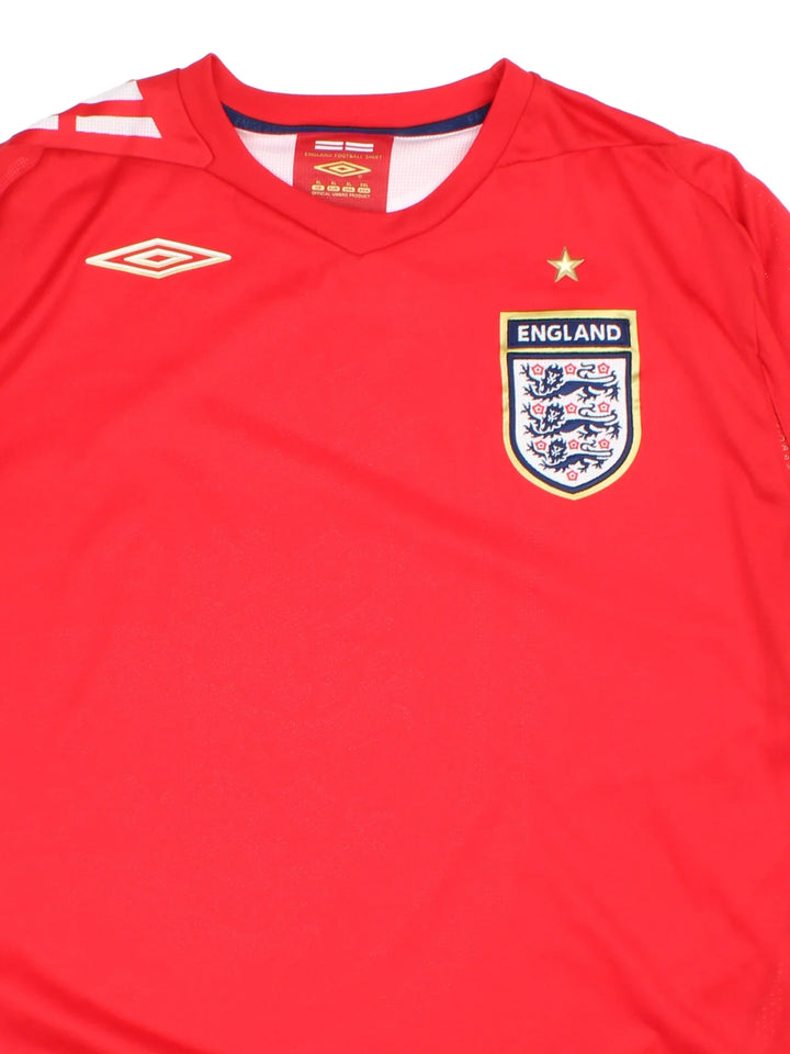 England 2006/08 Umbro Football Shirt in the red away kit colourway with classic badge on the front.