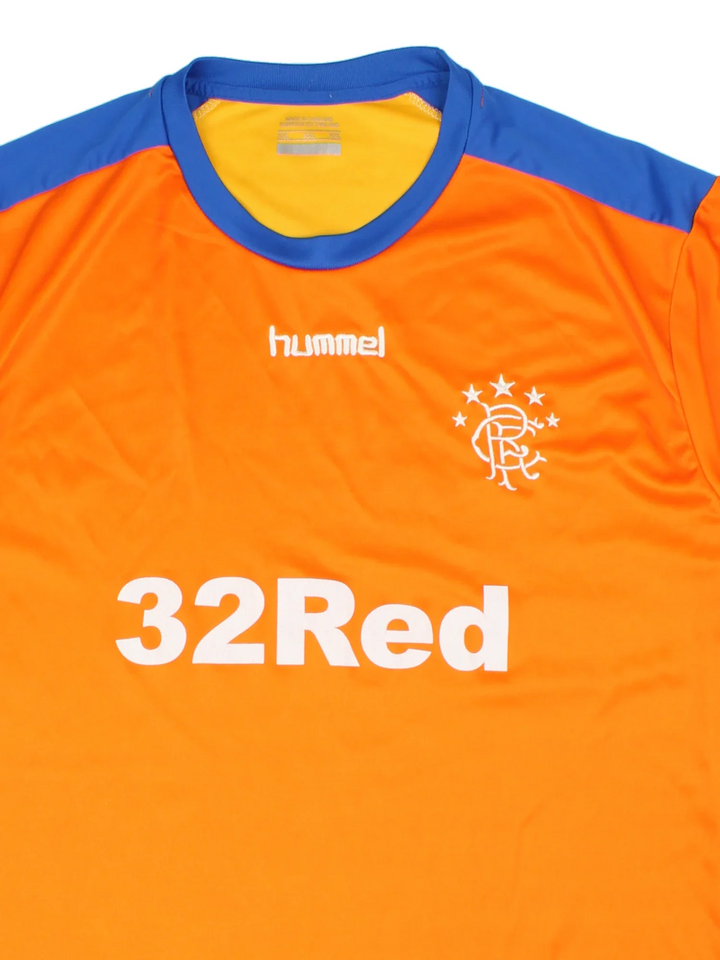 2019/20 Rangers Vintage Football Shirt in the orange home kit colourway, features embroidered logos and badge on the front, brand detailing under arms and large sponsor on the front.