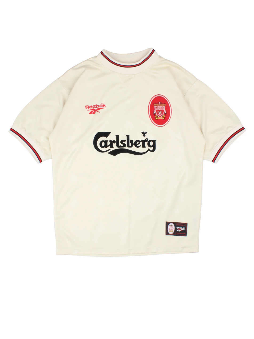 1996/1997 Liverpool Reebok Football Shirt in a tan colourway with red and black detailing around the collar and sleeves. Logo and badge on the front with large classic sponsor