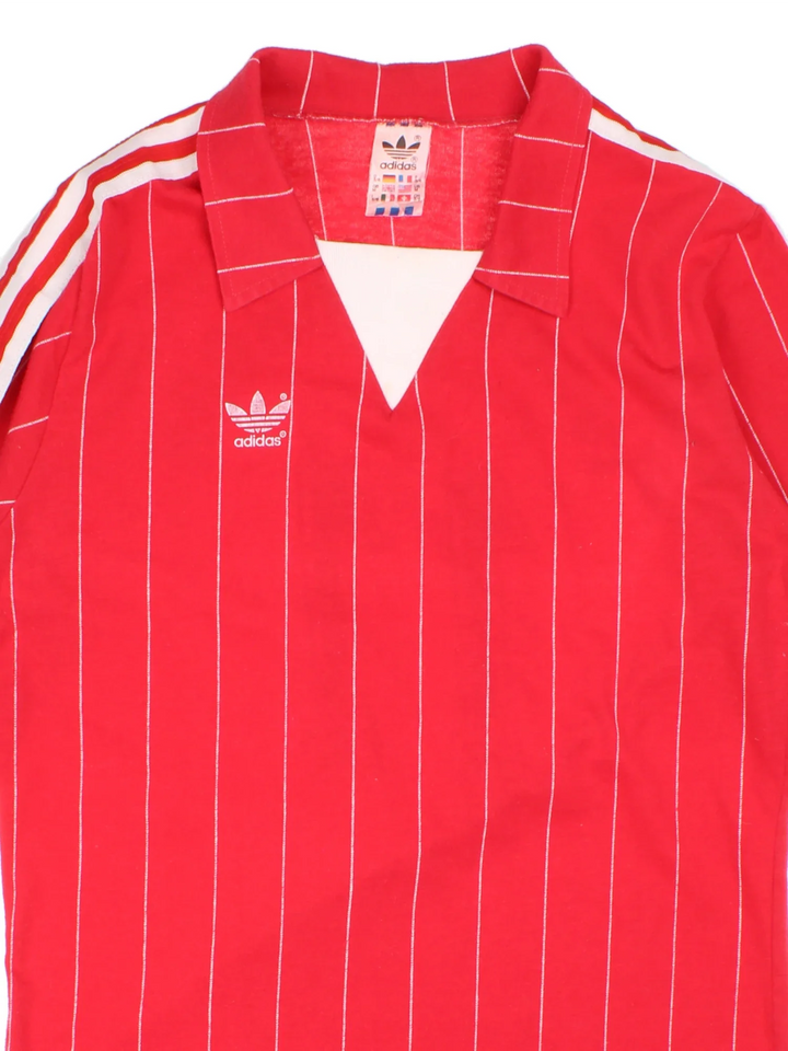 Vintage 80's Adidas Football Shirt in a red and white colourway with the logo printed on the front and Turbo Korborn number 11 on the back.