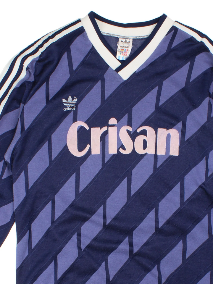 Vintage 80's Adidas Football Shirt in a blue and white colourway with the logo and sponsor printed on the front and number 14 on the back.