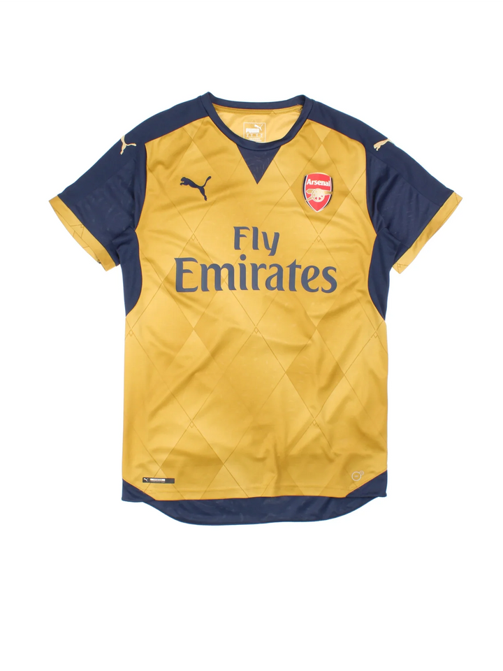 2015/16 Arsenal Puma Away Football Shirt in a golden brown and navy colourway with the logo and sponsor on the front.