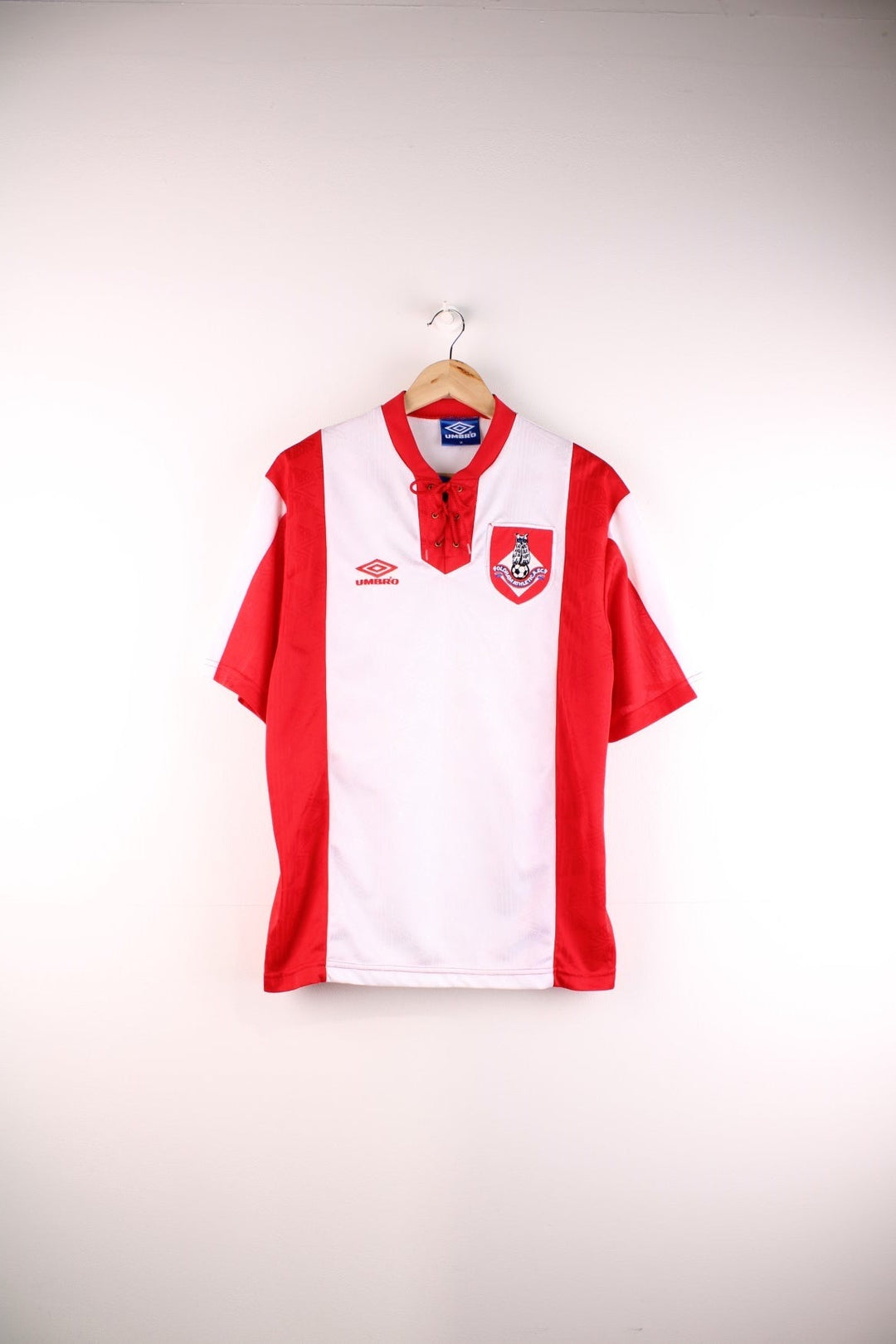 Vintage Oldham Athletic 1992/94 Umbro Football Shirt in the white and red away kit colourway, features embroidered logos and badge on the front.