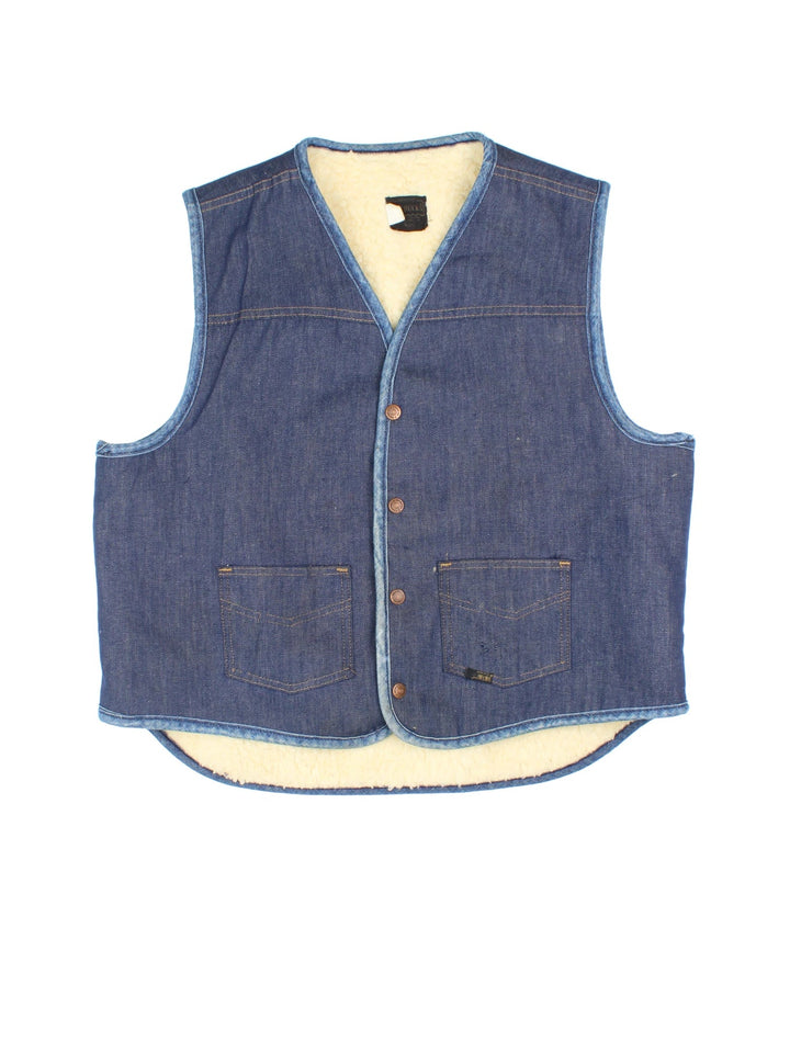 Vintage Roebuck Denim Shearling Vest in a blue colourway. Buttons up, with front patch pockets and branding embroidered on front.
