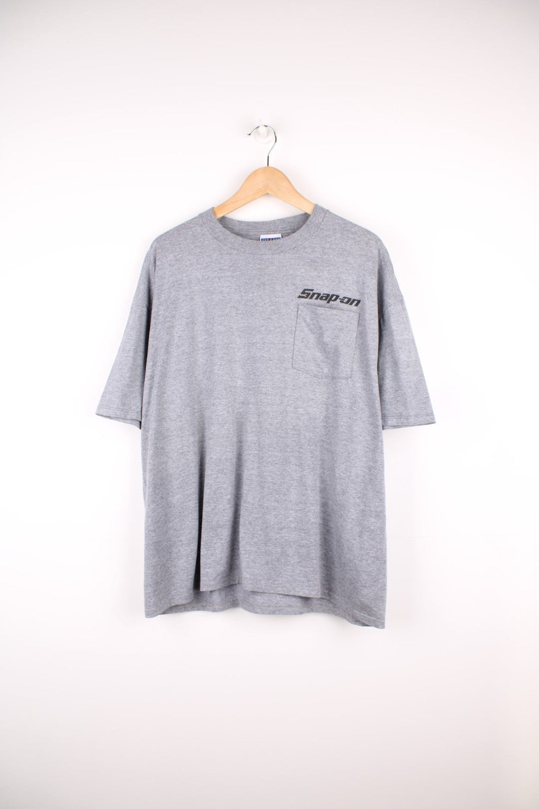 Snap-On T-Shirt in grey with pocket and printed logo on the chest, and large graphic sun print on the back.