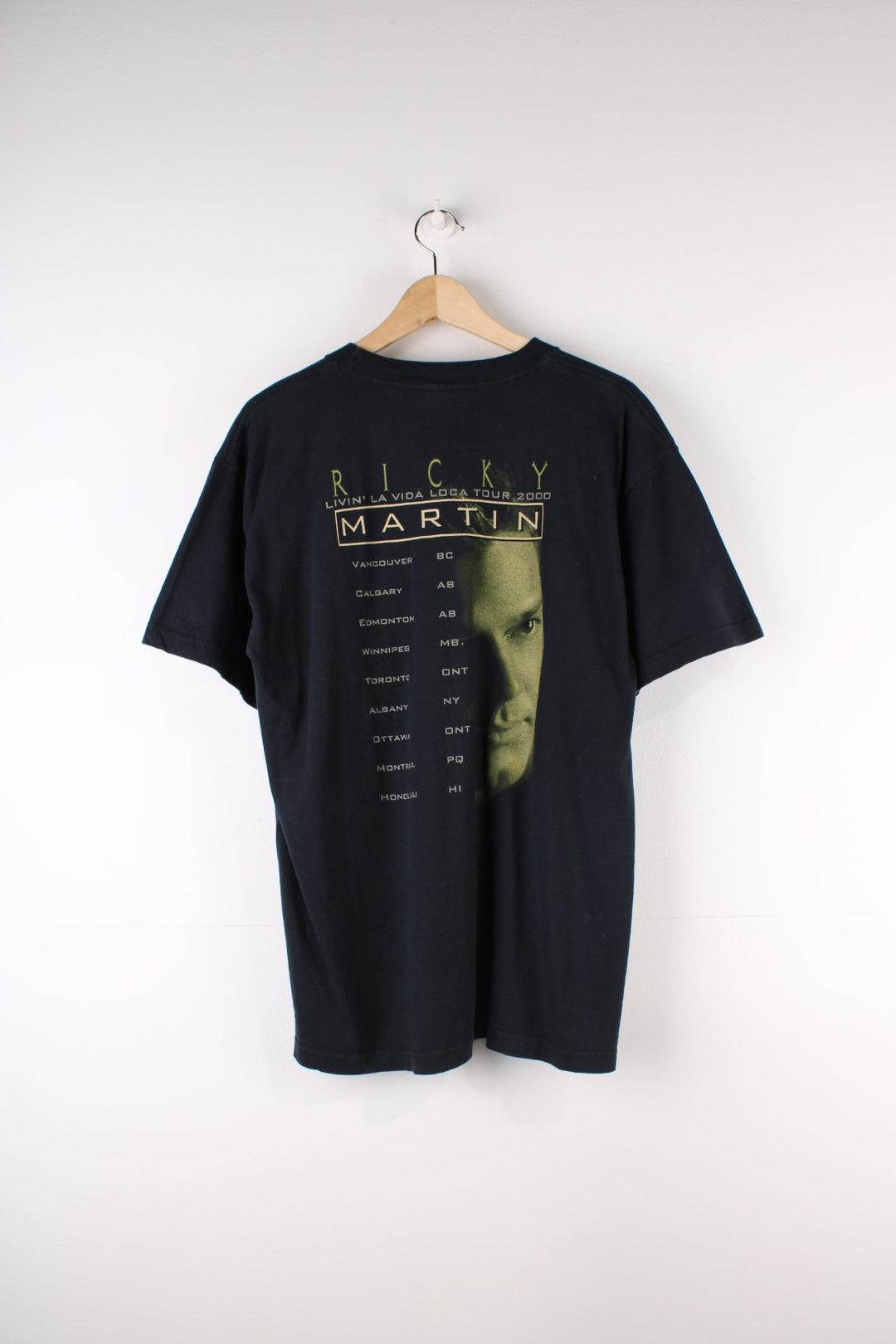 Vintage 2000 Ricky Martin Livin La Vida Loca Tour T-Shirt in a black colourway with Ricky Martin graphic printed on the front and on the back the tour locations.