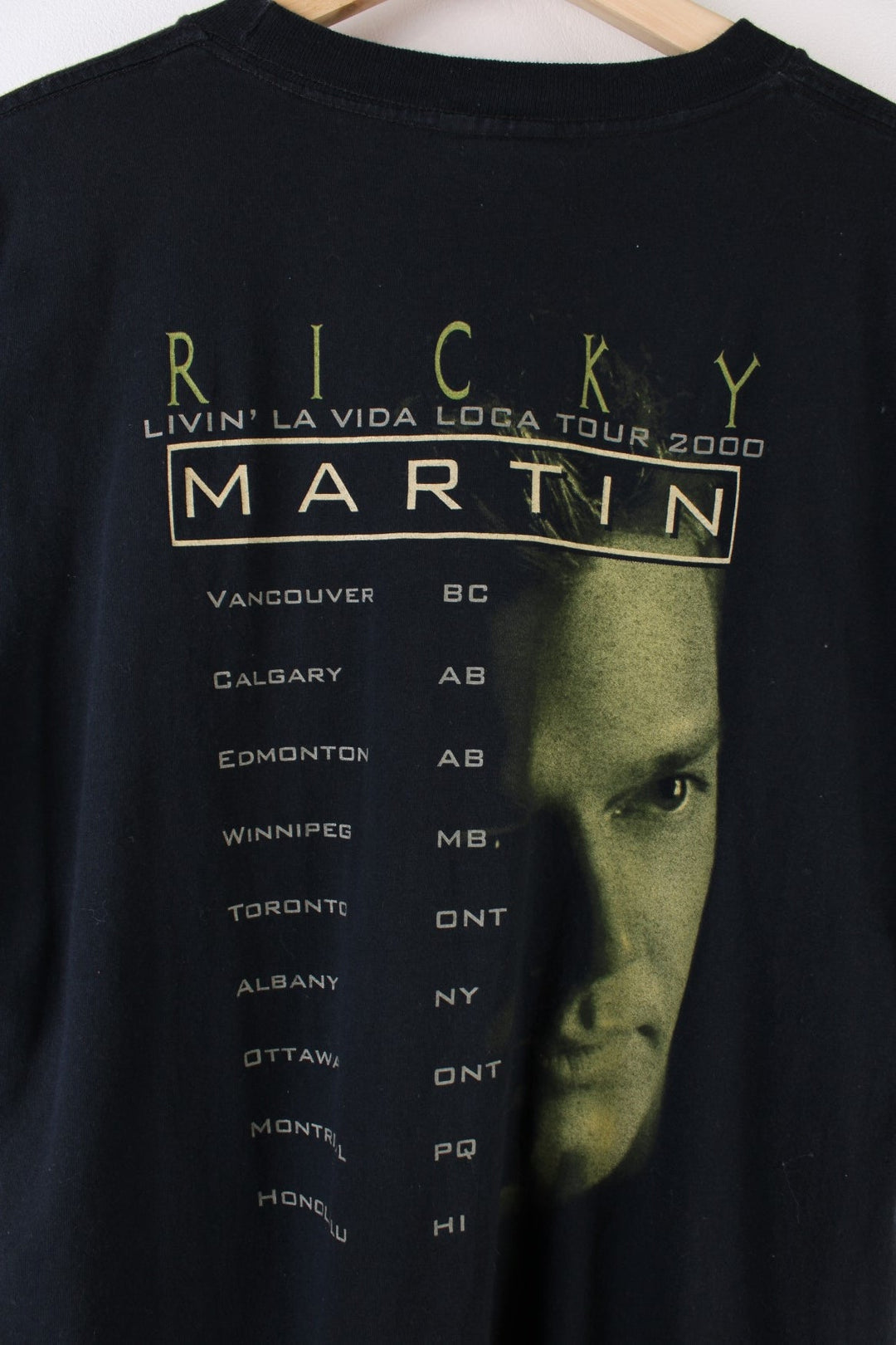 Vintage 2000 Ricky Martin Livin La Vida Loca Tour T-Shirt in a black colourway with Ricky Martin graphic printed on the front and on the back the tour locations.