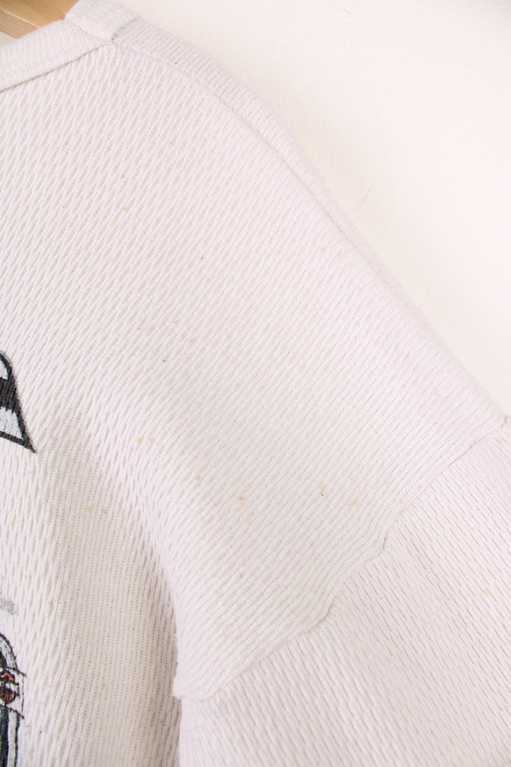 2001 Harley-Davidson, Daytona Beach, Florida long sleeved top in an off white/light beige colourway. Features printed spell out logo across the chest and graphic print on the back. 