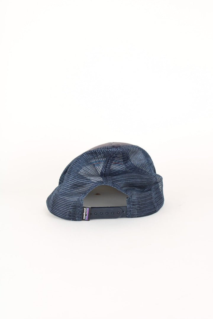 Patagonia Trucker Cap in a blue colourway with the logo embroidered on the front, mesh back, and has adjustable snapback.