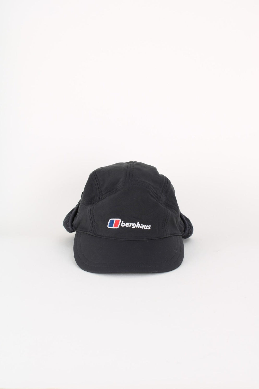 Berghaus Windstopper Cap in a black colourway with the logo embroidered on the front, and windstopper panel on the sides and back.