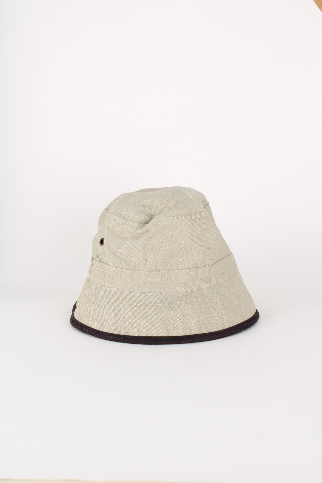 Y2K Von Dutch Reversible Bucket Hat in either a black or beige colourway options, and has the logo embroidered on.