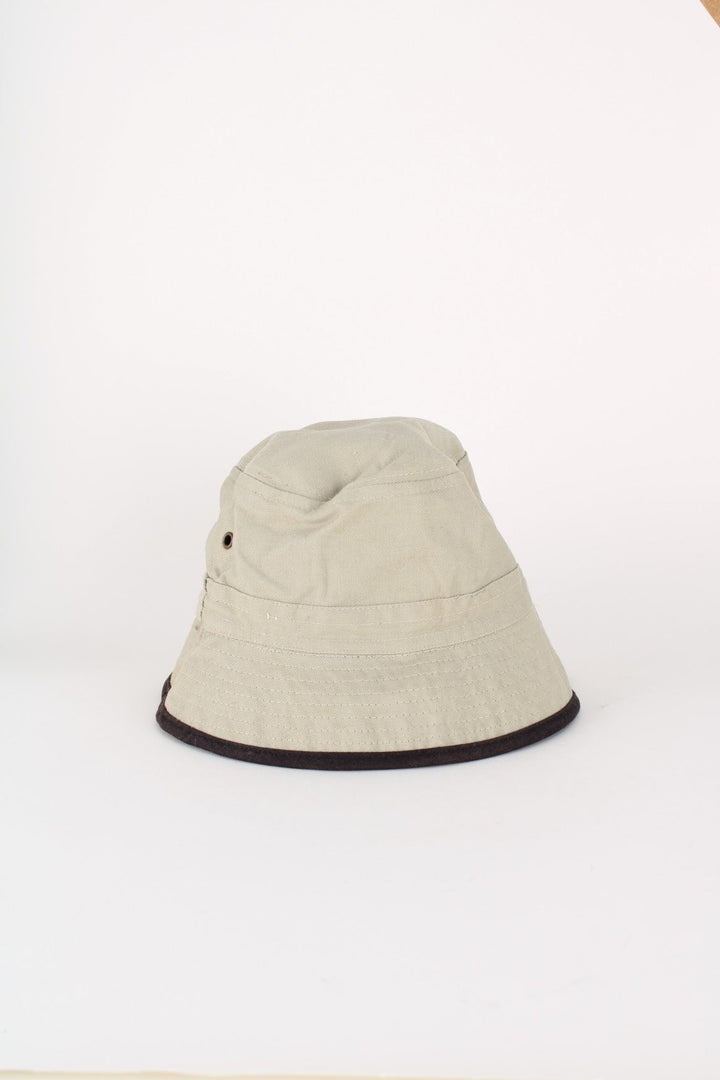 Y2K Von Dutch Reversible Bucket Hat in either a black or beige colourway options, and has the logo embroidered on.