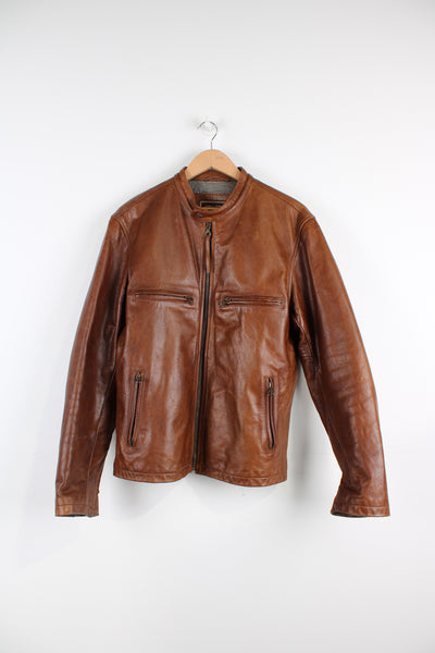 Vintage Marlboro Classics brown leather jacket with multiple pockets, quilted lining and adjustable zip on the cuff on the arms. 