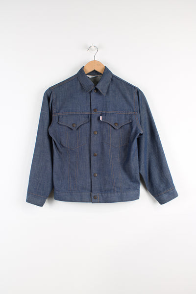 Vintage Levi's trucker style denim jacket in blue, button up with two pockets on the chest. 