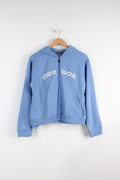 Vintage Reebok zip up hoodie in blue, with embroidered spell-out logo across the front. 