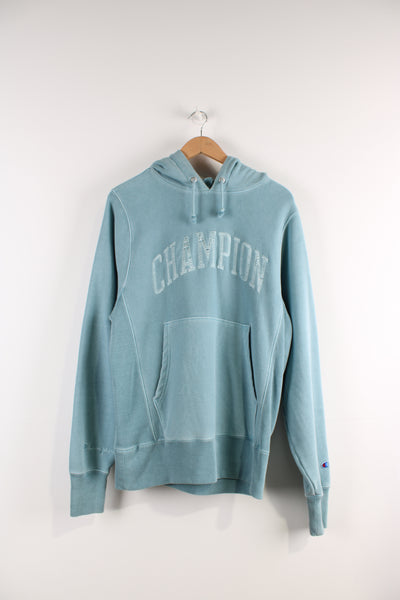 Vintage Champion reverse weave hoodie in blue, embroidered spell-out on the chest and sleeve. 