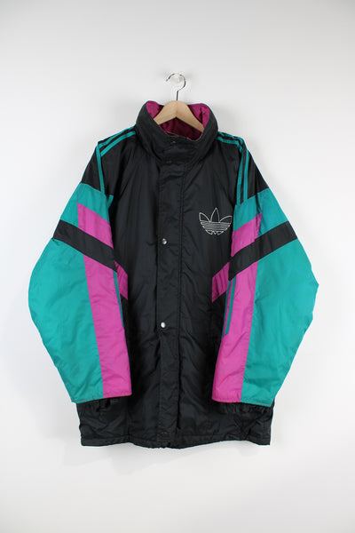 Vintage 00's black, teal and pink Adidas sports coat with three stripe detail down the arms and printed logos on the chest and back. The coat closes with a zip and popper buttons and also has a detachable hood.  good condition   Size in Label:  Mens 38/ 40 - Measures like a mens L 