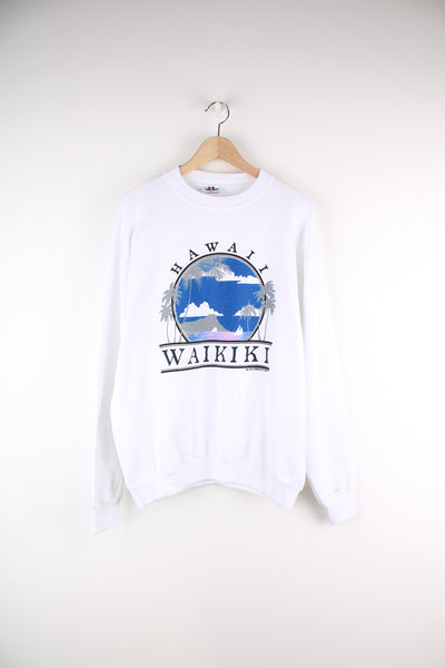 Vintage 90's Hawaii Waikiki Graphic Sweatshirt in a white colourway with big graphic print and spell out going across the front.