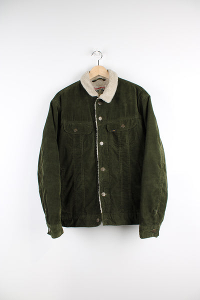 Vintage Lee Storm Rider corduroy jacket in green, button up with multiple pockets, and has a white sherpa lining. 