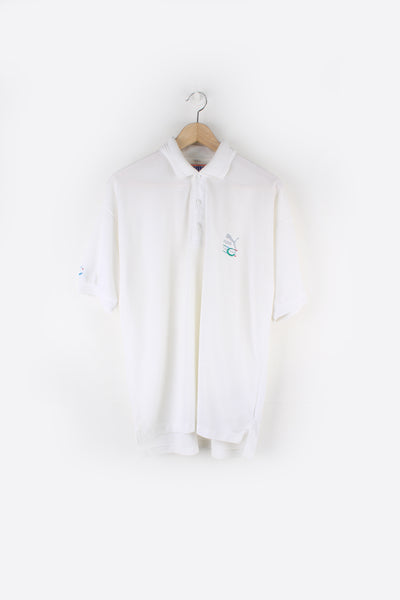 Puma Function Polo Shirt in a white colourway, button up collar, short sleeved and has the logo embroidered on the front and back.
