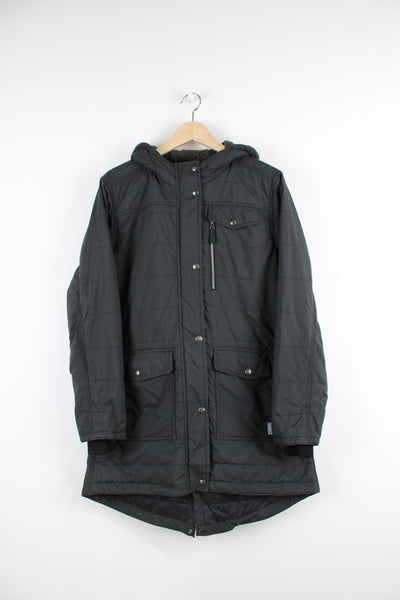 Vintage Carhartt padded parka jacket in black, has a quilted lining, multiple pockets, hooded and Carhartt logo on the pocket.