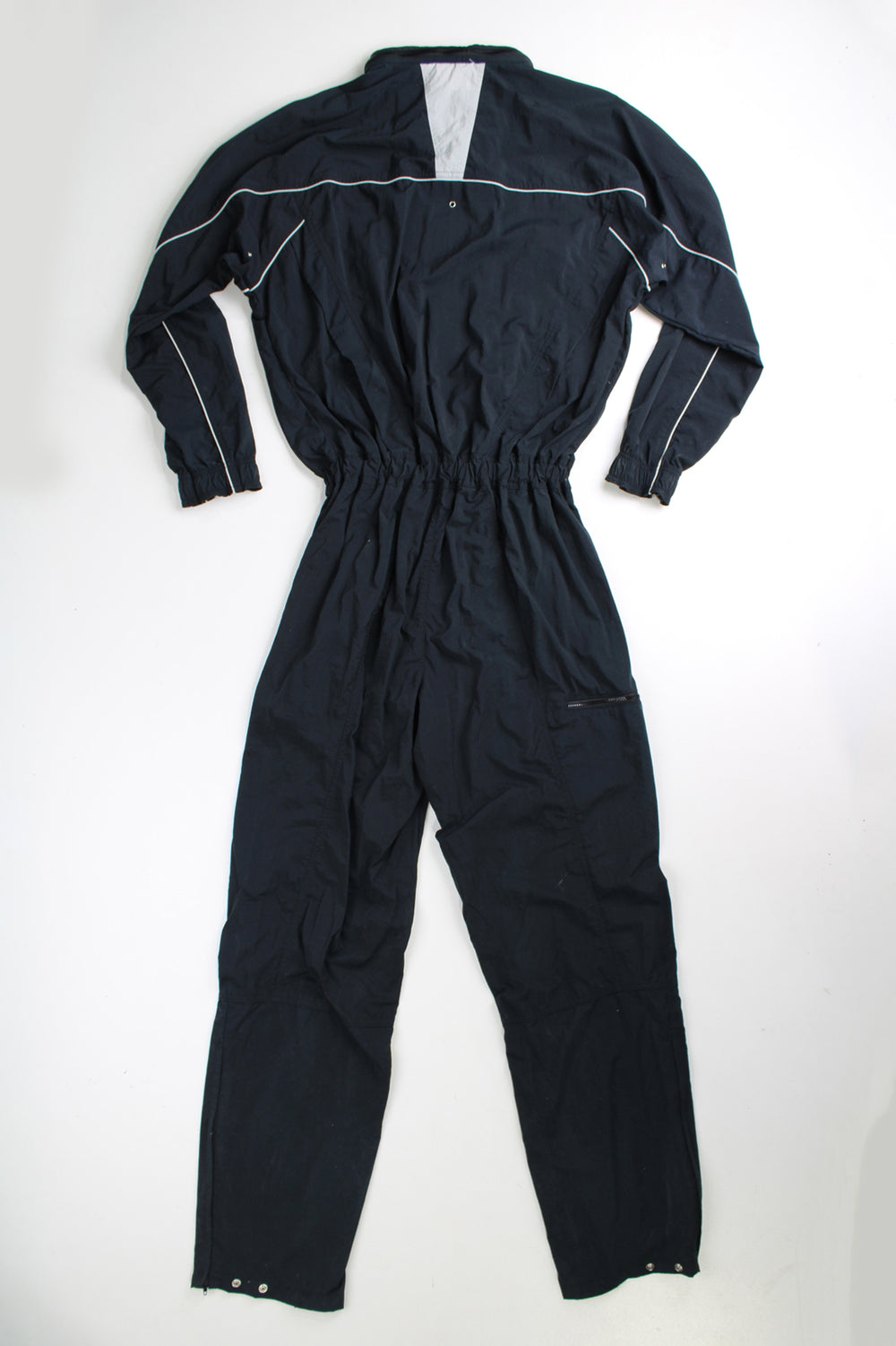 Vintage 90's Nike  black jumpsuit. Features embroidered logo on the chest, fold away hood and the waistband is elasticated at the back.  good condition - Four very small holes on the shoulder Size in Label: Mens M