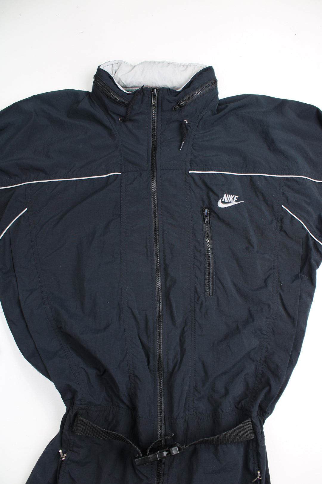 Vintage 90's Nike  black jumpsuit. Features embroidered logo on the chest, fold away hood and the waistband is elasticated at the back.  good condition - Four very small holes on the shoulder Size in Label: Mens M