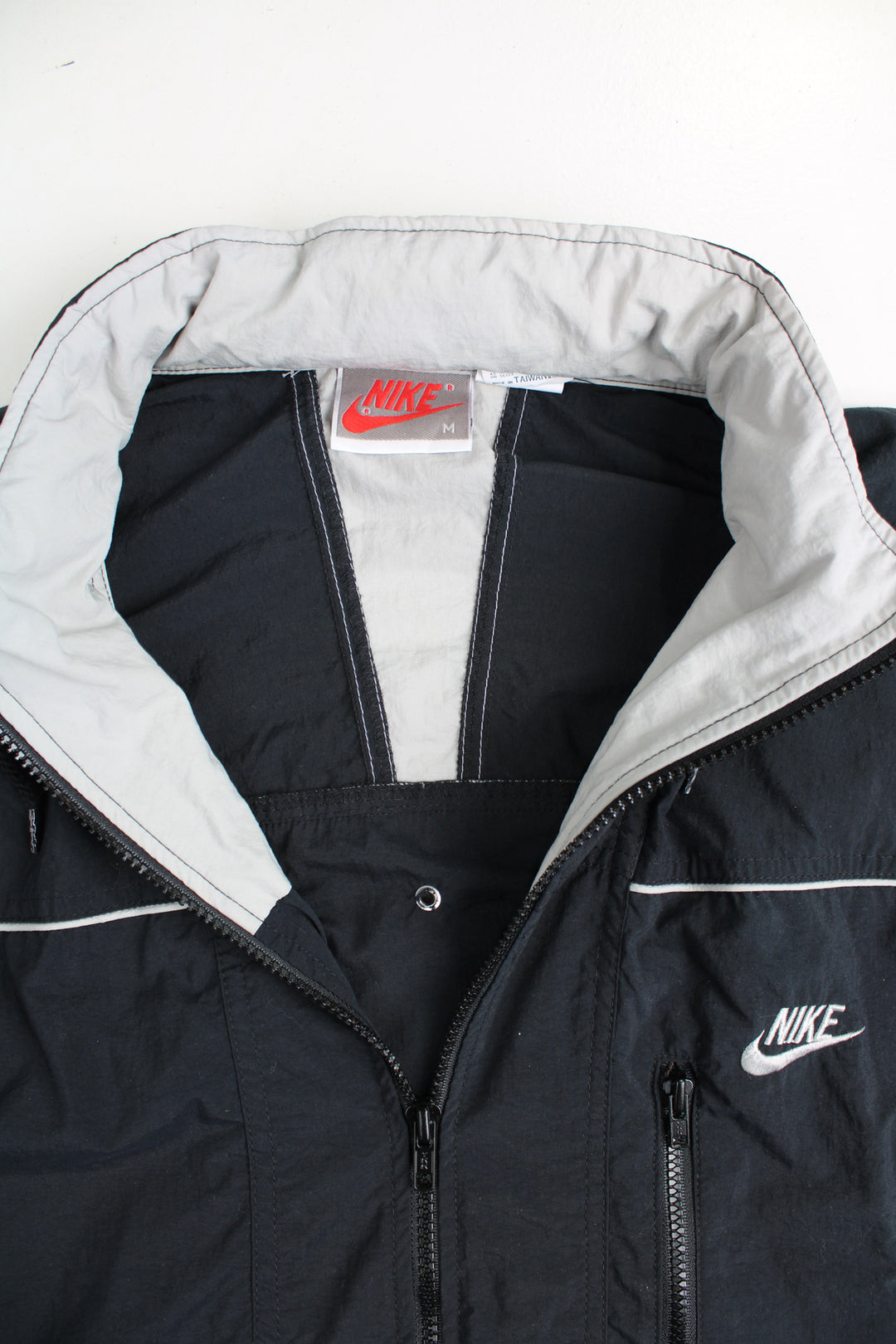 Vintage 90's Nike  black jumpsuit. Features embroidered logo on the chest, fold away hood and the waistband is elasticated at the back.  good condition - Four very small holes on the shoulder Size in Label: Mens M