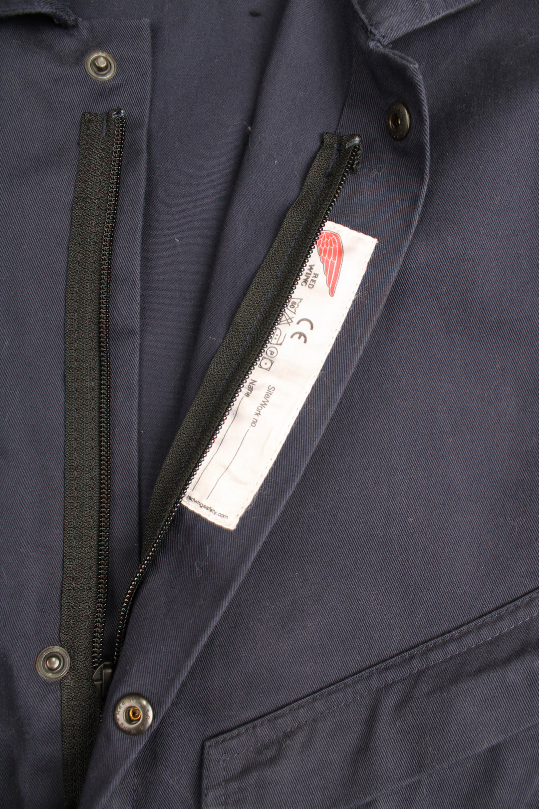 Red Wing full length cotton jumpsuit in navy blue with embroidered logo on the waistband. Waistband is elasticated at the back and closes . good condition- some marks on the legs (see images) Size in Label: UK Mens 42 (L)