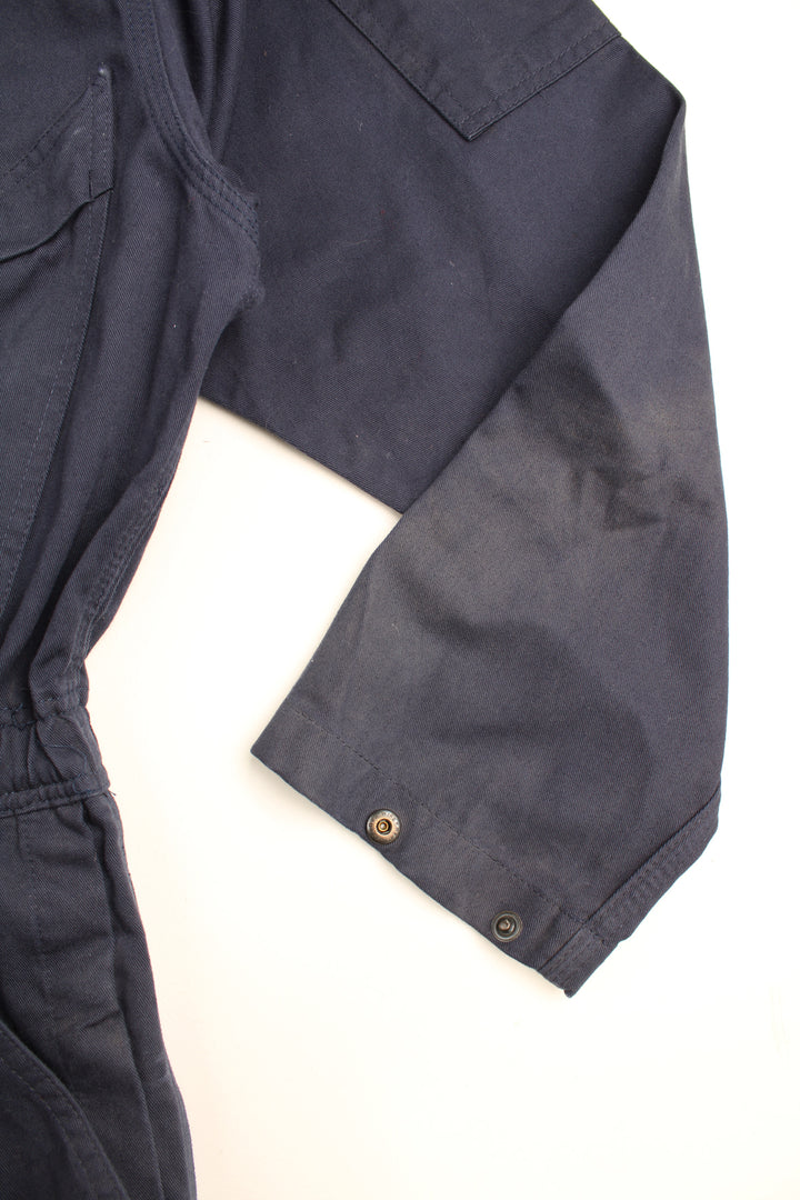 Red Wing full length cotton jumpsuit in navy blue with embroidered logo on the waistband. Waistband is elasticated at the back and closes . good condition- some marks on the legs (see images) Size in Label: UK Mens 42 (L)