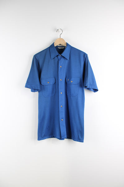 Vintage looks like 70/80's Christian Dior all blue button up shirt with dagger collar and embroidered logo on the chest