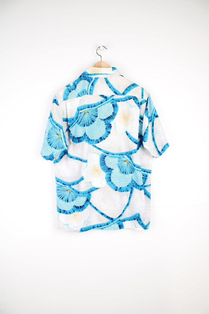 Vintage Mr.Kailua Hawaiian Shirt with blue flower print and chest pocket.