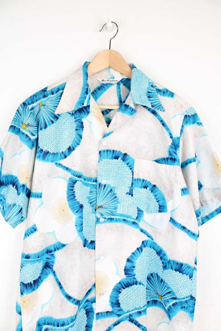 Vintage Mr.Kailua Hawaiian Shirt with blue flower print and chest pocket.