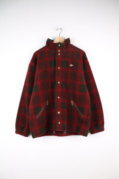 Lacoste Tartan Fleece Jacket in a red and green colourway with a corduroy collar lining, button up with side pockets, and has the logo embroidered on the front.