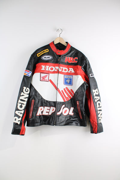 Vintage Honda Repsol zip through leather motorcycle racing jacket in red and black, features embroidered sponsor badges through out